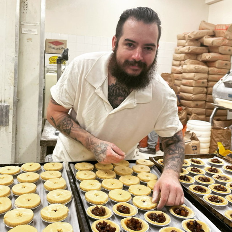 Justin filling trays of fruit mince tarts