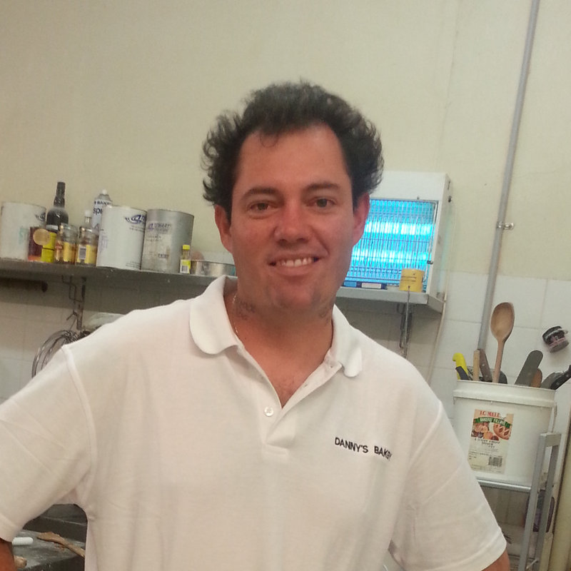 Russell in his bakery whites in the kitchen