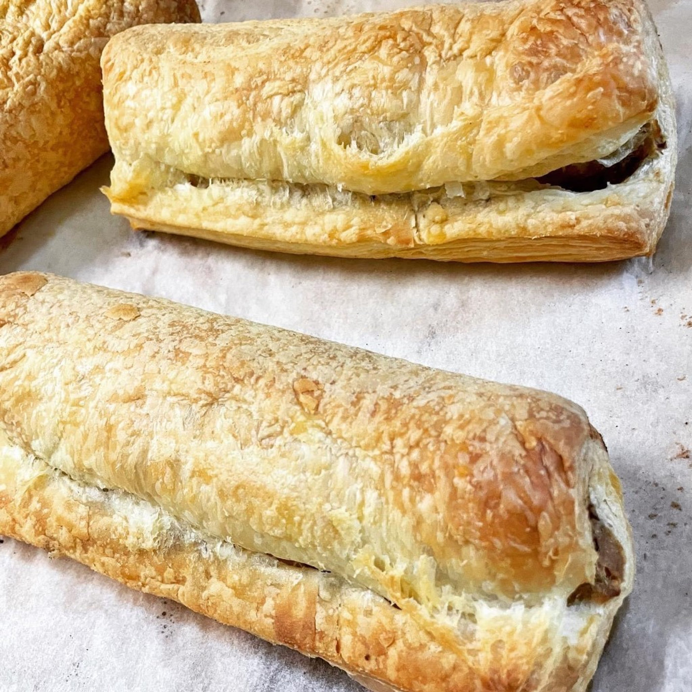 Sausage rolls on baking paper